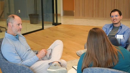Participants in Chapman & Co.'s Truly Human Leader cohort sitting in a small group discussion